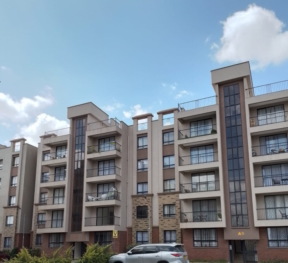 The development is located near SGR and Gateway Mall.
Special features include:
Spacious lounge with balcony; master ensuite with walkin closet; underground water storage; open terrace and party area; internet and TV access points; 24hr manned security with CCTV; fully fitted solar panels; spacious pantry and wash areas; children's play areas; fully fitted gym; designer kitchens and wash areas; sufficient parking.
2-bedroom units (98 square meters) selling for Kshs. 7.8m while 3-bedroom units (120 square meters) are selling for Kshs. 9.2m only. Rent charged for 2-bedroom units in the development is Kshs. 42,000 whereas for 3-bedroom units is Kshs. 52,000 only. Secure neighborhood.
Get in touch to schedule a viewing. Entire development sits on a 5-acre lot approximately and comprises 16 blocks each having 5 floors per block and 2 units per floor.